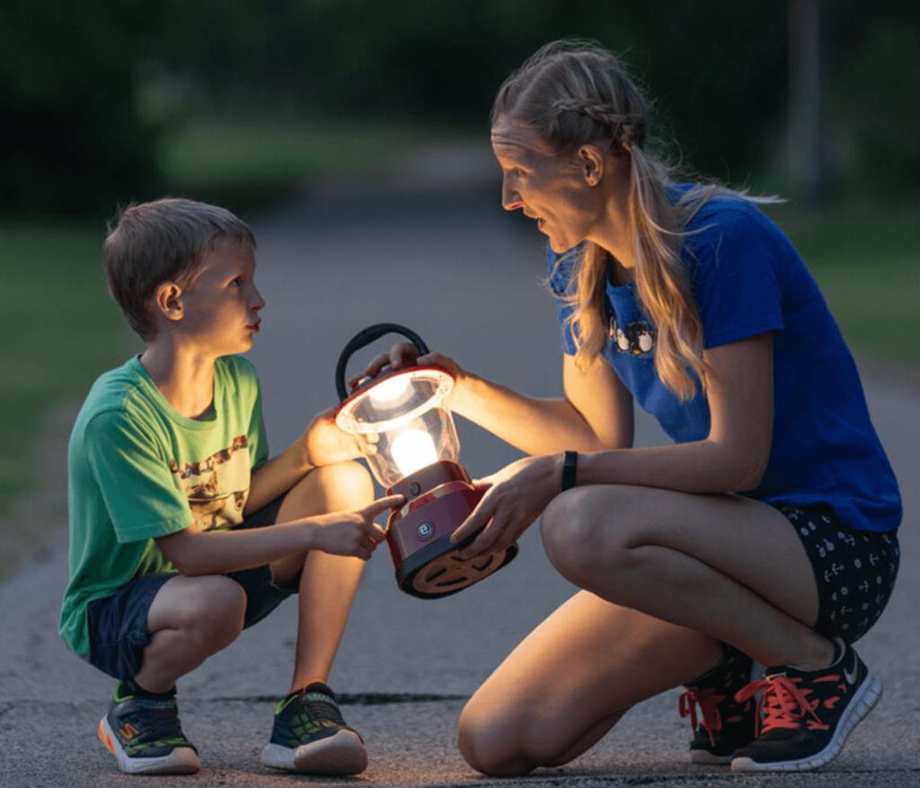 Mom and son holding Enbrighten outdoor camp lantern