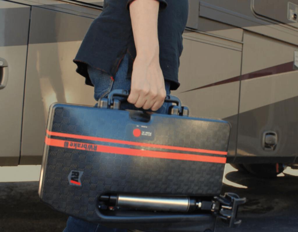 Man carrying auxiliary braking system for dinghy towing