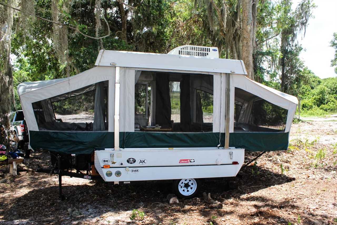 Pop-up tent trailer folded out at a campsite