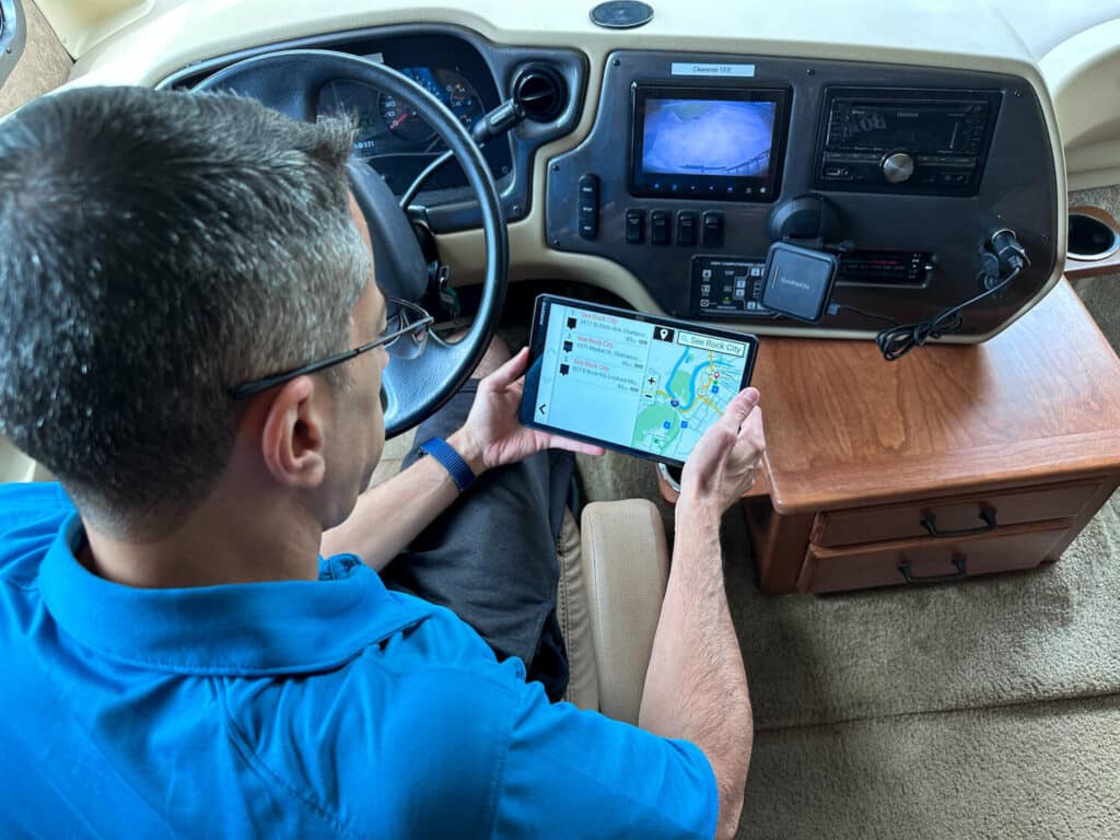 Man looking at directions on Garmin GPS unit