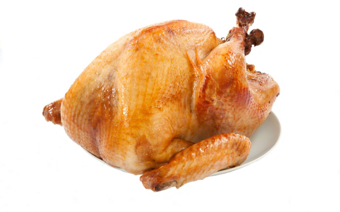 Mouth-watering golden roasted turkey over white background, no garnish.