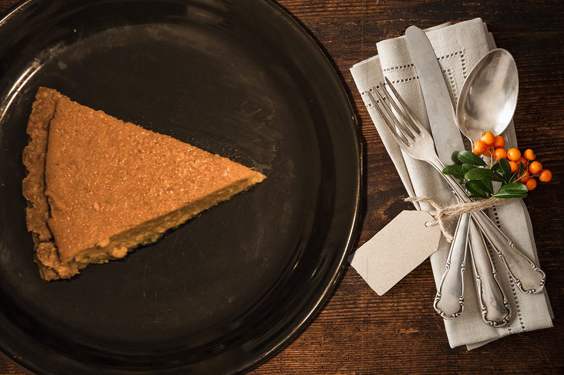 Plate of pie on table setting.