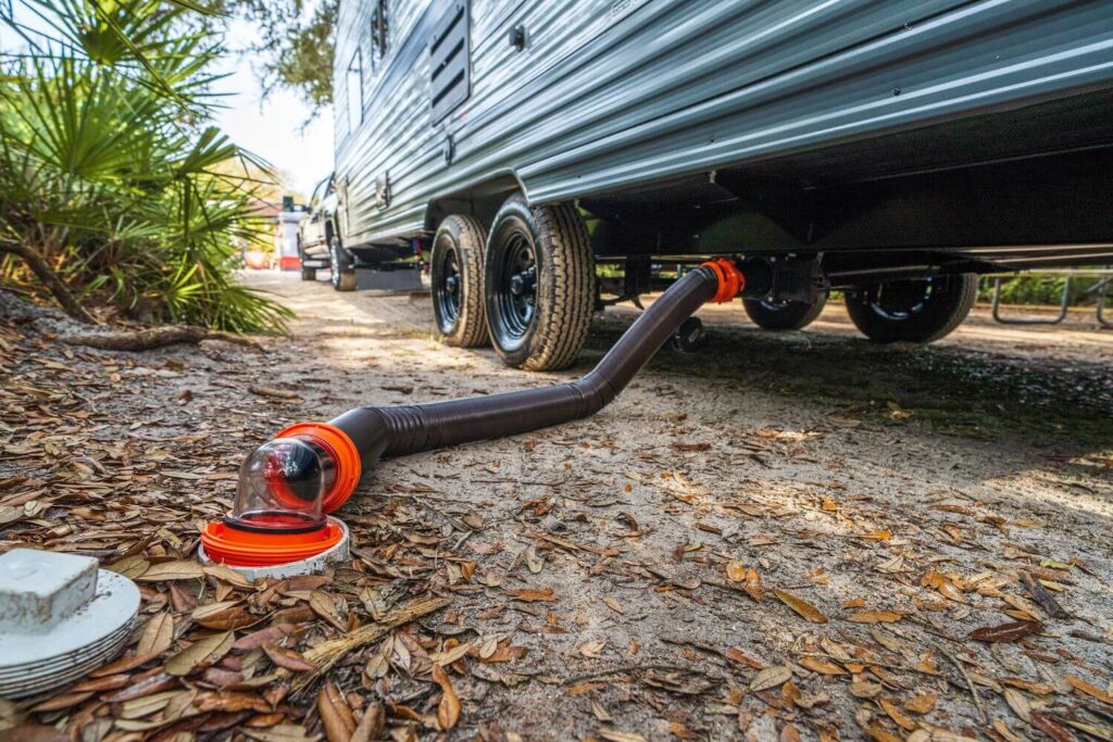 RV sewer hose connected to campsite hookup