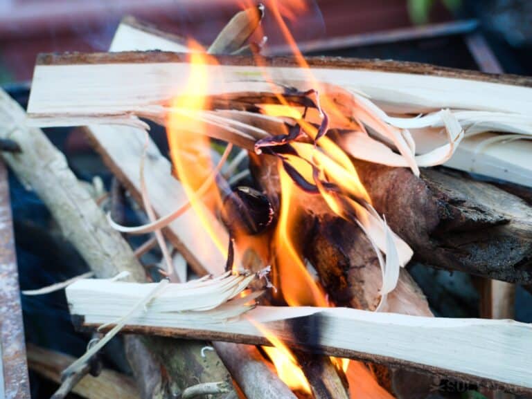 feather sticks burning in outdoor fire