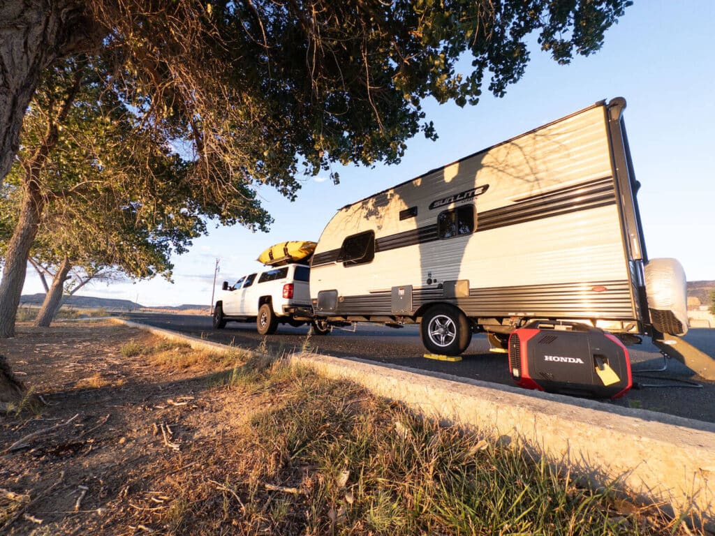 Travel trailer and truck with Honda portable generator outside