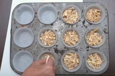 filling muffin cups with sawdust