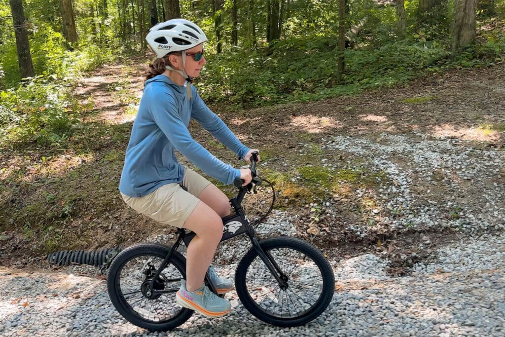 Woman riding on gravel path for Jackrabbit ebike review