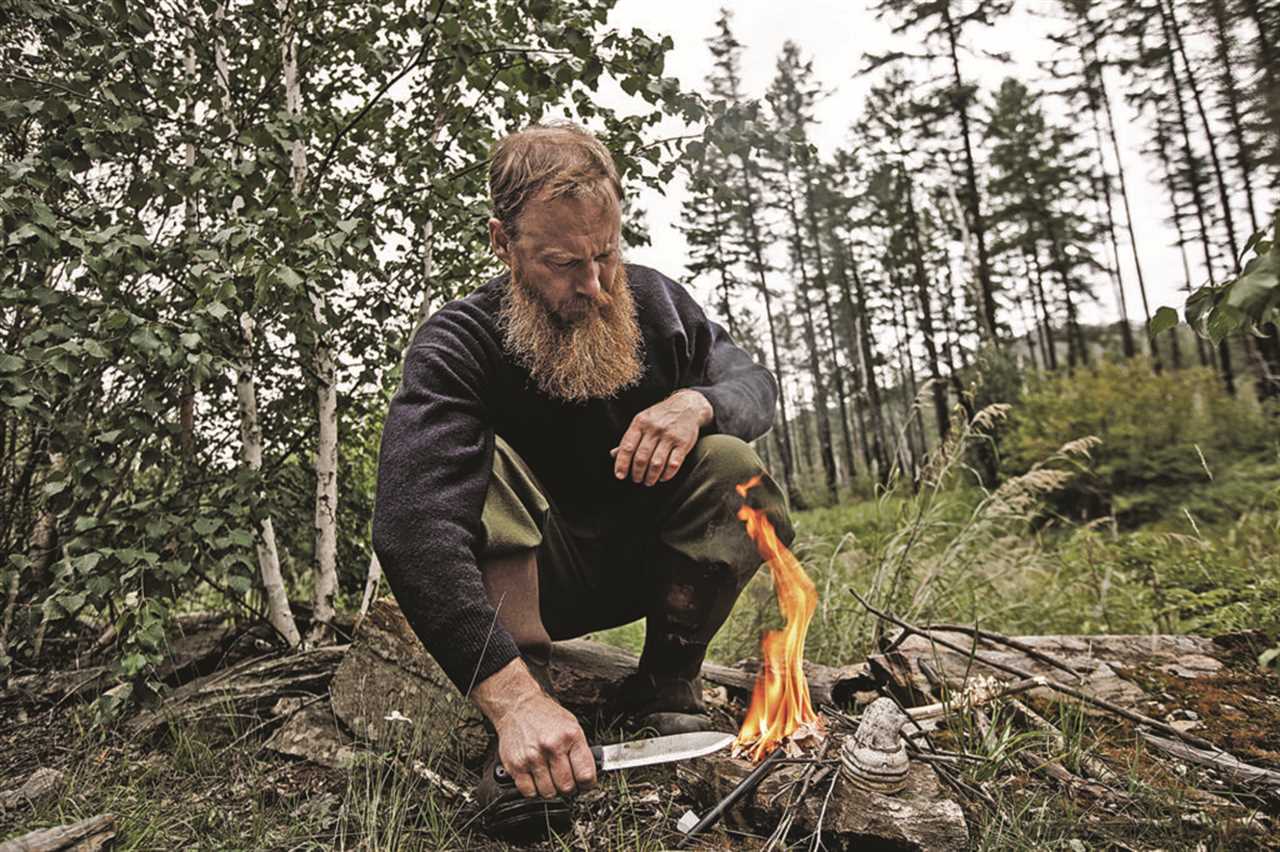 Larry Roberts starting a fire.