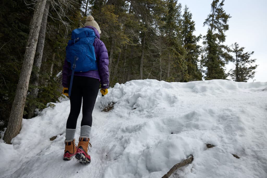 Women walking up a snowy icy hill on the Wapta Falls hike in Yoho National Park