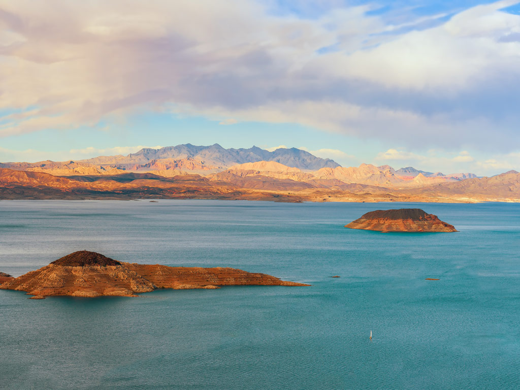 A breathtaking view of the mountains in the distance and Lake Mead in Nevada as seen in the morning around sunrise in early winter 