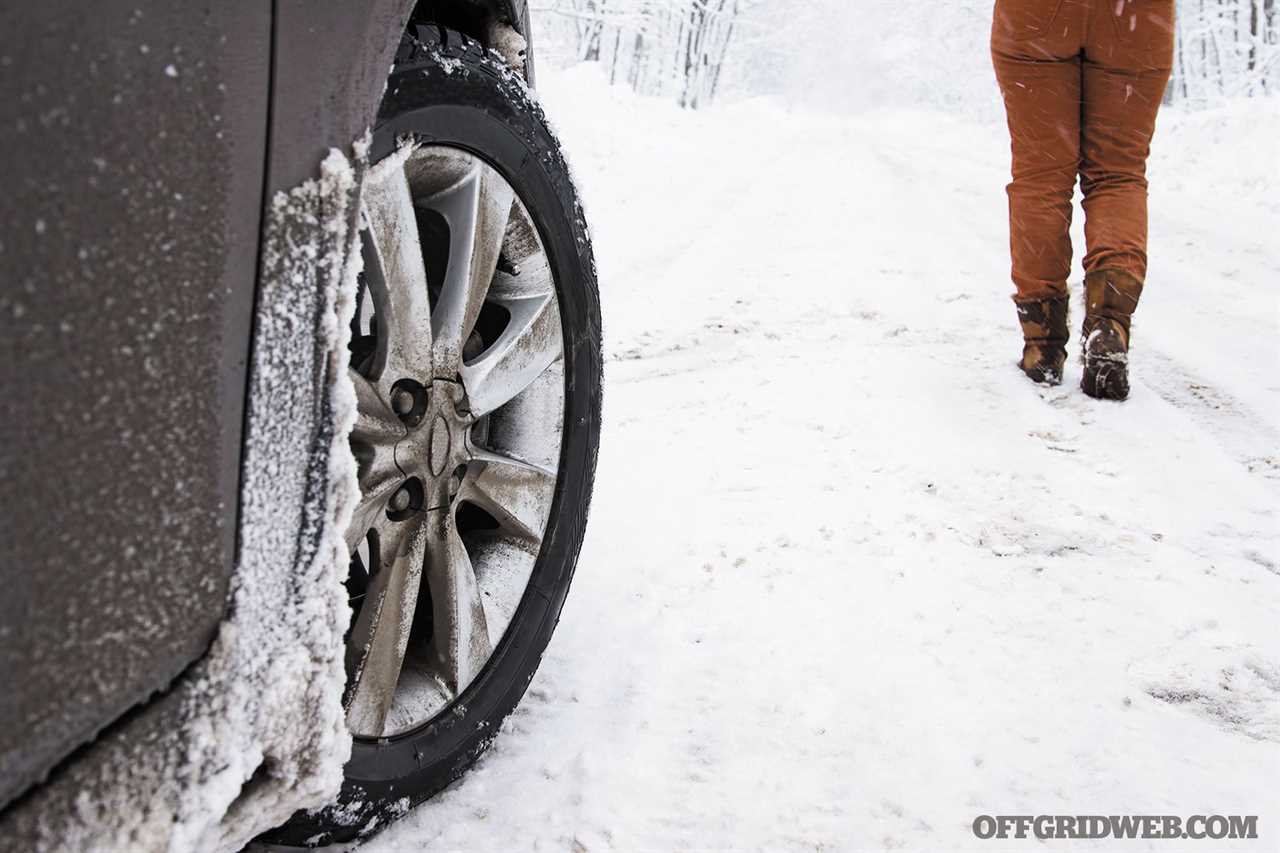 Someone walking away from their vehicle presumably stuck in a snowbank. This can be avoided by preparing your vehicle for cold weather.