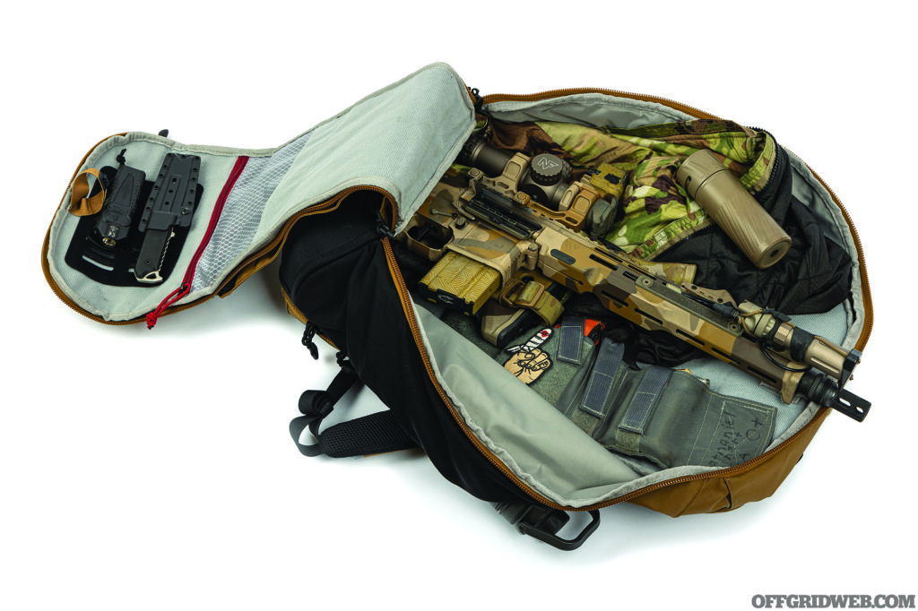 Studio photo of a carbine in a bugout bag.