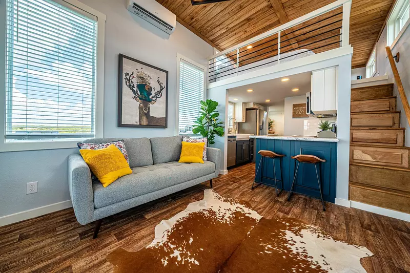 Interior of small living space with loft and kitchen.