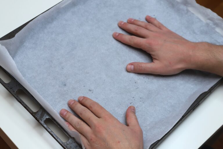 lining baking sheet with parchment paper