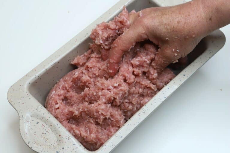 adding mixture to loaf pan