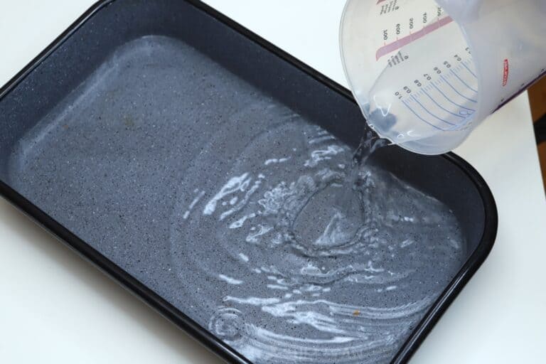 pouring water in baking dish