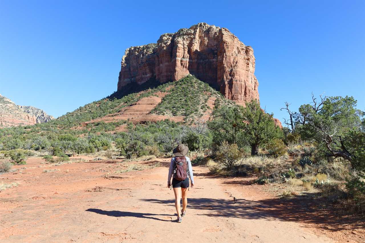 Woman hiking toward Bell Rock in Sedona