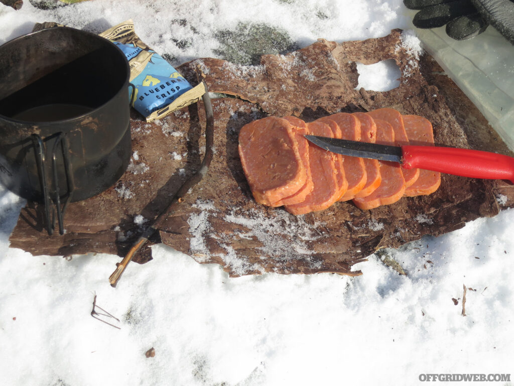 Photo of sliced span on a piece of frozen bark.