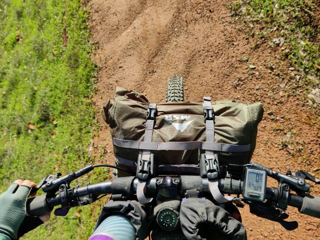 Looking down on bike handlebars with the MSR handlebar bag attached