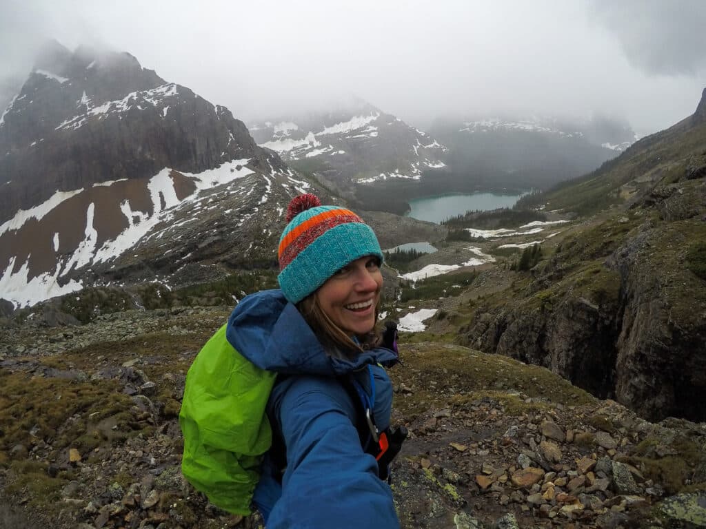 Bearfoot Theory founder Kristen Bor hiking on a foggy rainy day at Lake O'Hara.