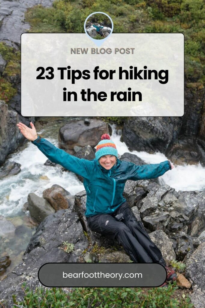 Woman dressed in rain gear sitting on wet rocks next to a waterfall. Text reads "23 Tips for hiking in the rain"