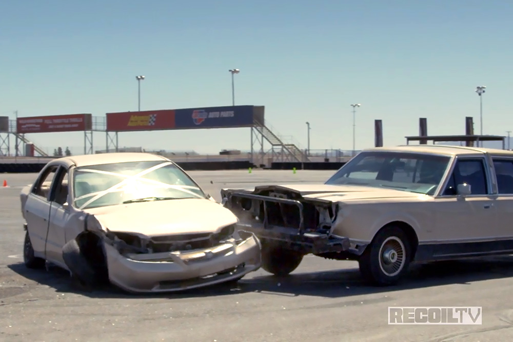 Photo of two cars pressed close together to create a road block.