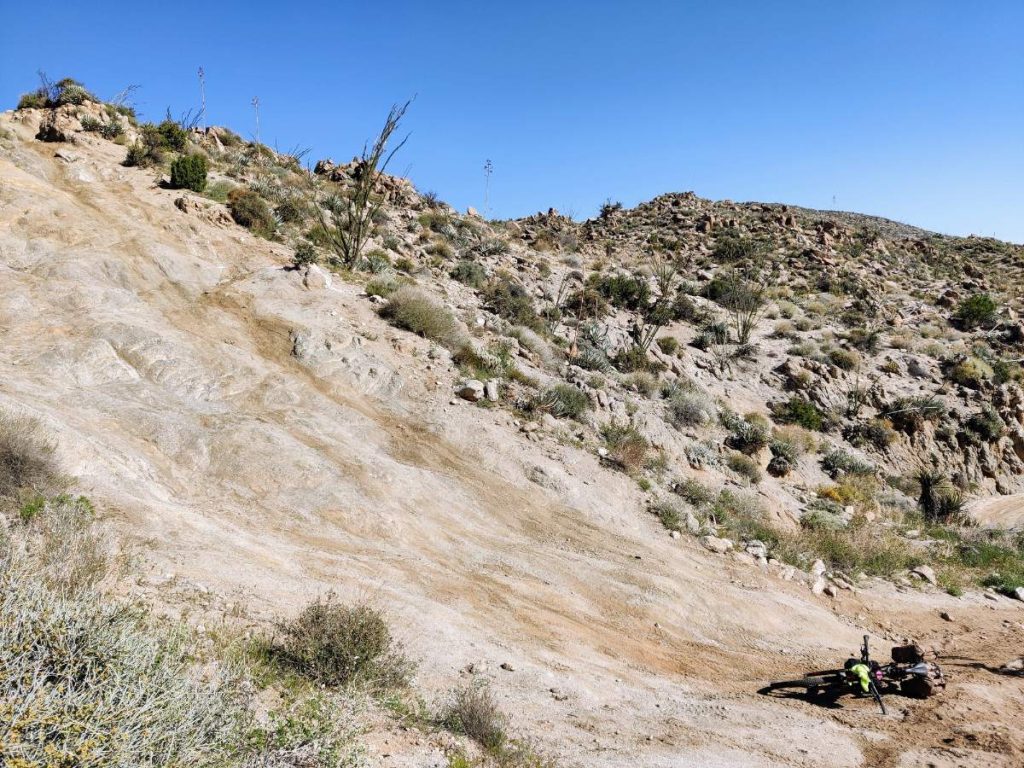 Bicycle lies at bottom of steep rocky hillside in Anza Borrego Desert