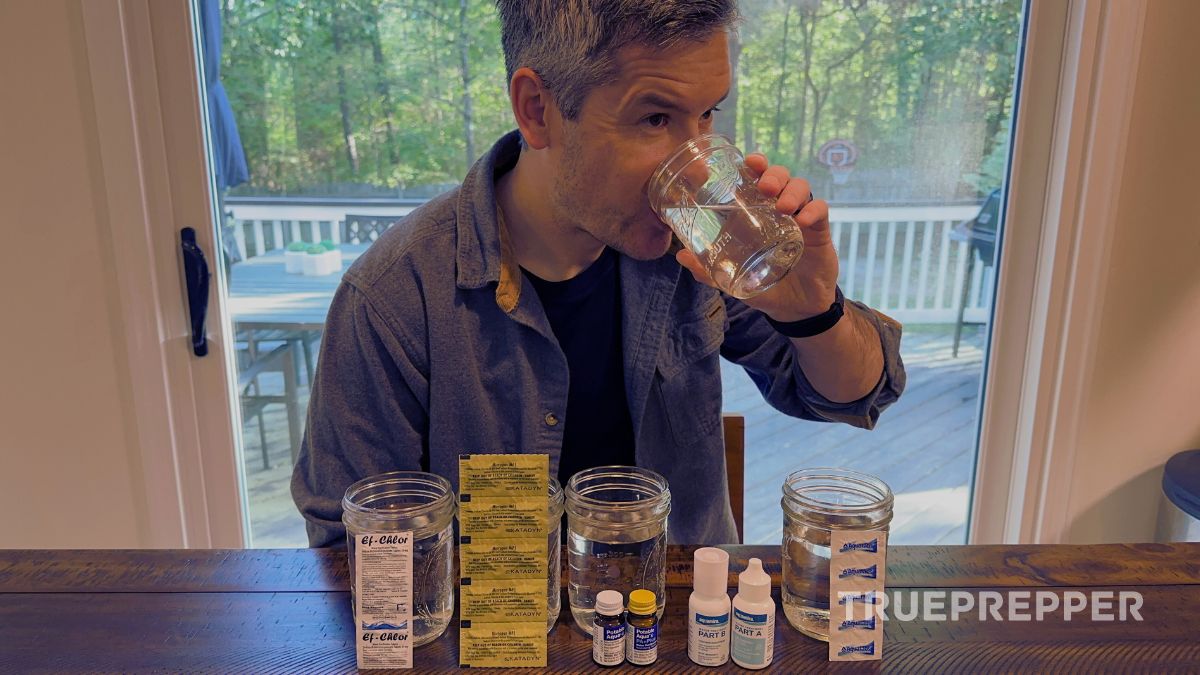 Sean sitting and taste testing various water purification tablets displayed on the table.