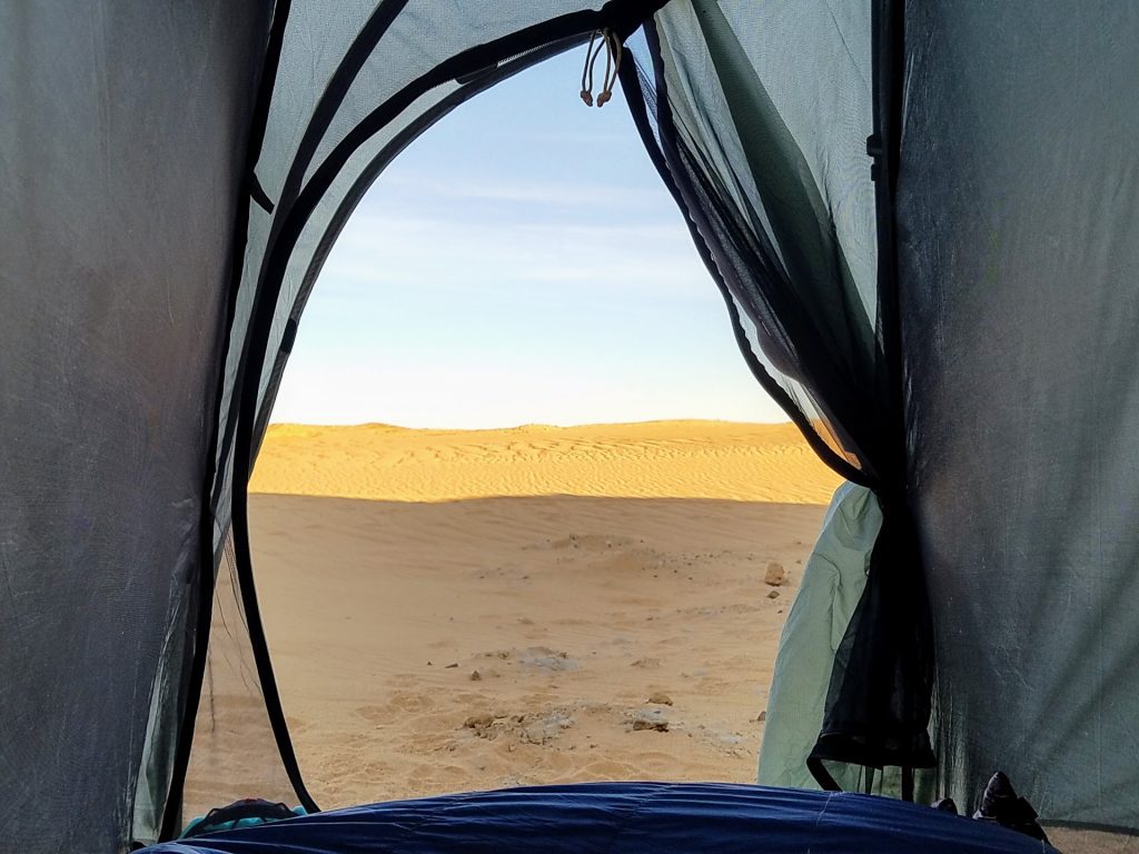 View of desert through door of tent