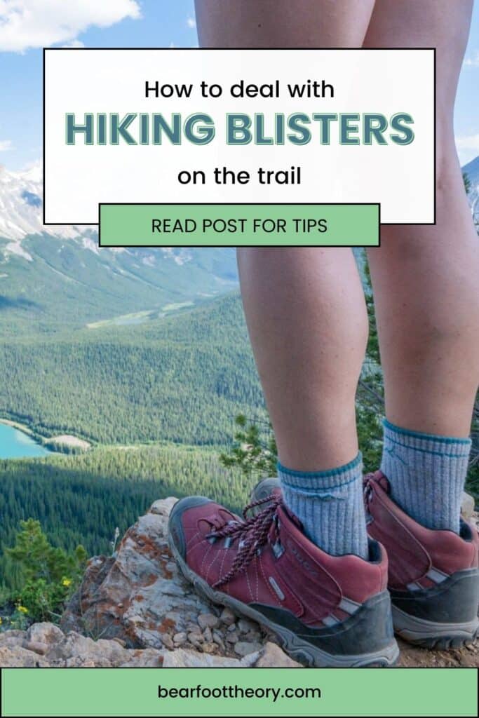 Pinterest pin of woman's legs and hiking boots on a rock overlooking a lake with the text "how to deal with hiking blisters on the trail - read post for tips"