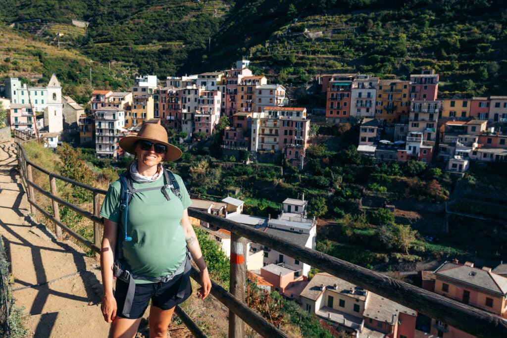 Kristen Bor hiking on Italy's Cinque Terre Trail wearing the Patagonia Cool Capilene daily hiking shirt