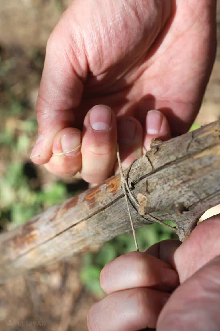 tying cordage around rod