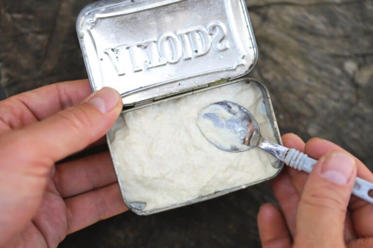 adding dough to tin