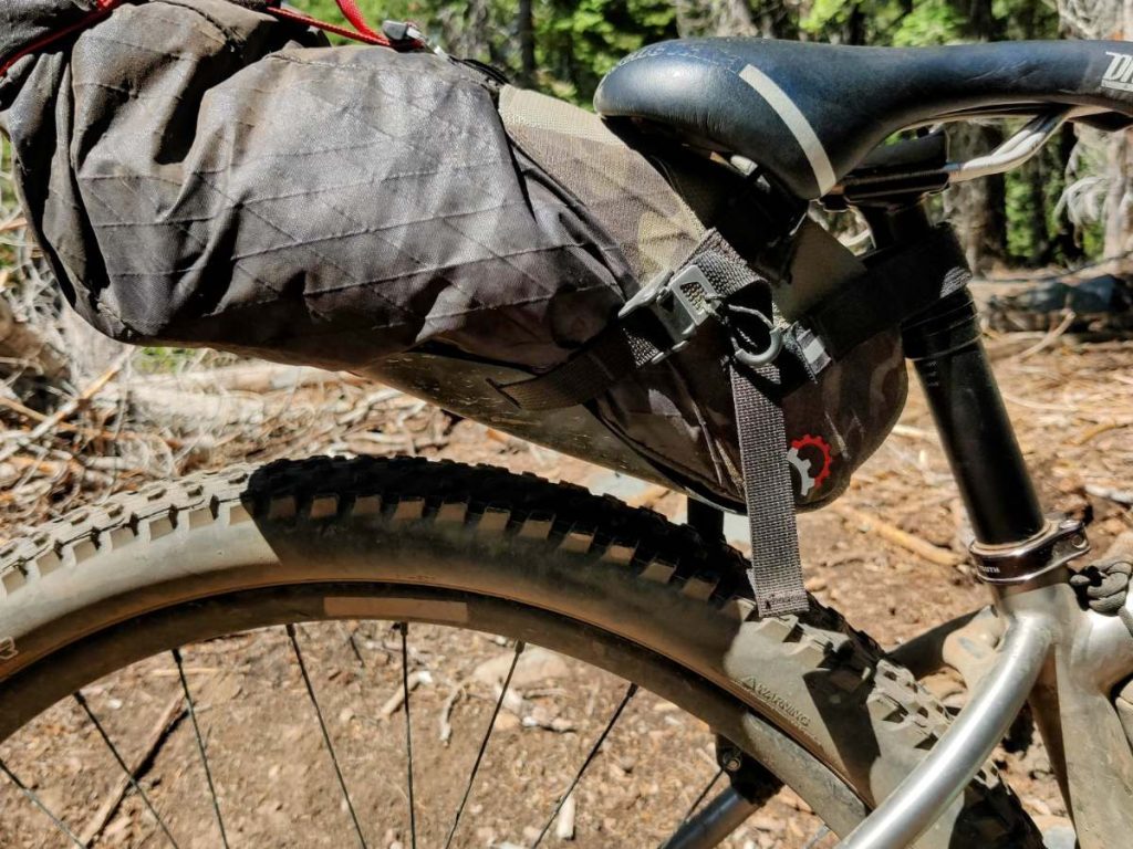 Bikepacking seat bag on dropper post lowered to just above rear tire